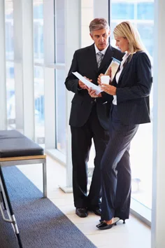 Business-Man-Women-standing-small-as