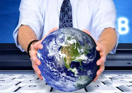business man with a globe coming out of a laptop screen - good concept for global technology