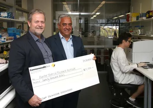 George-Rafty-presents-Professor-Michael-Nilsson-with-cheque-for-20000